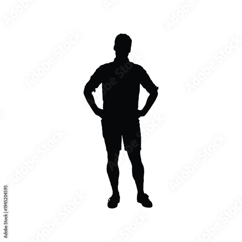 Confident Silhouette of a Young Man Standing Firmly with Both Hands Placed on His Hips in a Powerful Stance