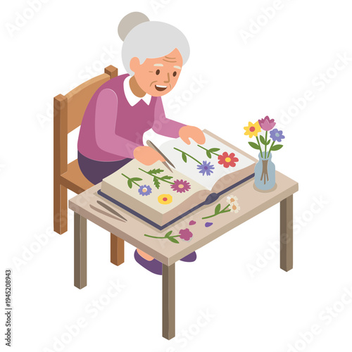 An elderly woman sitting indoors is arranging colorful flowers from a large book onto a table with a vase.