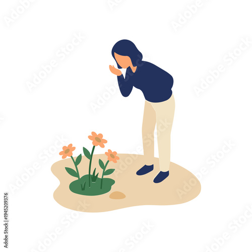 A woman is smelling flowers in a garden outdoors