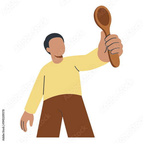 Man holding wooden spoon up in air with right hand standing