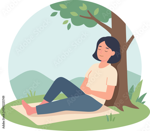 Woman relaxing under a tree on a blanket in a peaceful outdoor setting