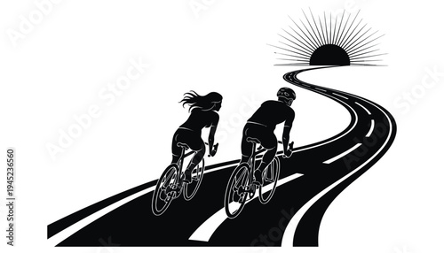 Bicycle silhouette of couple riding on road towards sunset