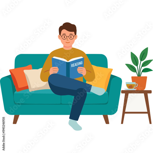 A man reads a book on a couch with pillows and a plant nearby