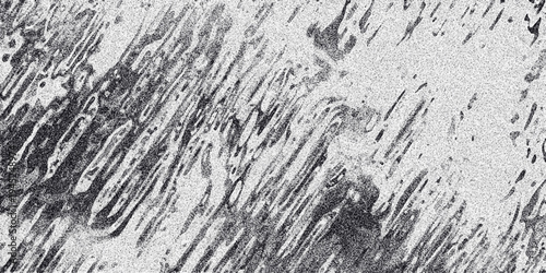 Abstract textured background with diagonal dark gray organic shapes and fine grain noise effect on a light gray backdrop creating a dynamic and artistic pattern