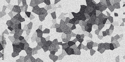 Dense abstract monochrome background featuring a dense arrangement of irregular polygonal shapes with a speckled grainy texture, forming a complex mosaic in grayscale