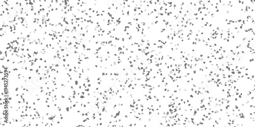 White background with a dense scattering of small irregular grayscale geometric shapes forming a speckled mosaic texture for abstract design