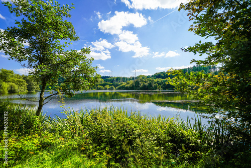 View of Lake Keddinghausen and the surrounding landscape. Flood retention basin near Keddinghausen. Nature by the lake.
