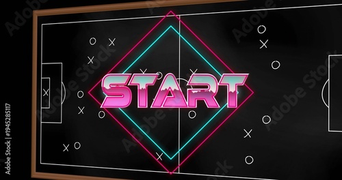 Displaying framed tactical board showing neon START wordmark and X O markers on soccer pitch