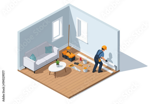 Home renovation a worker installs baseboards in a room with a couch and tools