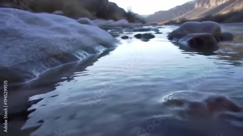 Wallpaper Mural Serene mountain landscape with river water flowing over rocks in nature. Scenic nature scene with rocks and water. Torontodigital.ca