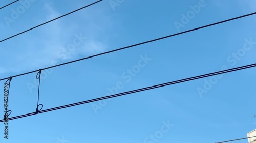 Overhead line catenary and a blue sky