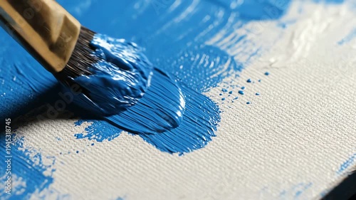 Close Up Blue Paint Brush Applying Acrylic Color on White Canvas Under Bright Lighting, Art Materials and Supplies, Smooth Texture, Vibrant Pigment, Artistic Creation