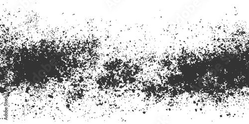 An artistic and abstract dark splatter paint design against a bright expanse. A study in texture, shadow, and minimalist aesthetics.