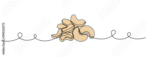 Cashew nuts piled on continuous line against white background