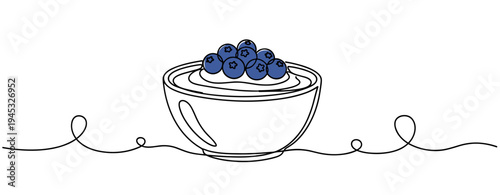 Bowl of yogurt topped with blueberries on continuous line kitchen