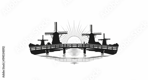 Silhouetted windmills on a bridge over water at sunrise