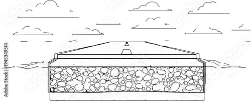 Stone-filled foundation with a sloped top and cloud-filled sky