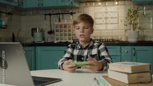 Kid Playing Mobile Games Instead of Doing Homework at Home