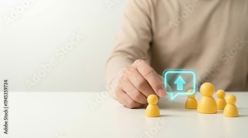 Promotion, Career growth, Human resources, Leadership, Success, Talent management, Business progress concept with hand touching yellow peg dolls and glowing upward arrow icon.