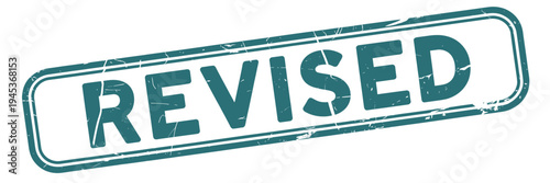 A teal colored sign prominently displays the word revised in bold uppercase letters