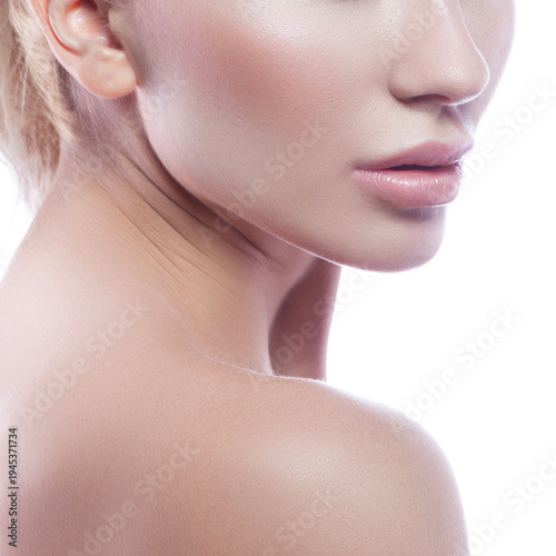 Lips and shoulder of model woman. Nude make-up, perfect skin. Skincare health concept