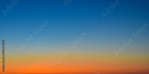 Artistic sunset sky with orange, purple, and yellow color palette