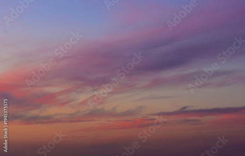 Majestic purple twilight sky with soft golden afternoon sun glow