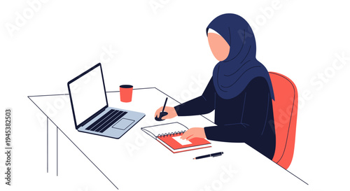 woman wearing hijab working on laptop.