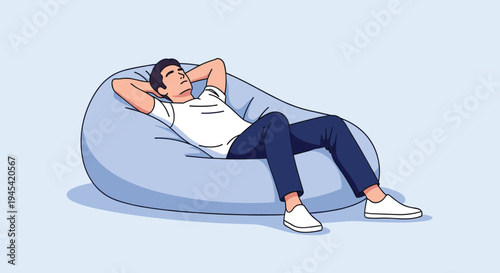 Content man in casual clothes is lying back and relaxing on a comfortable light blue bean bag chair in a bright room.