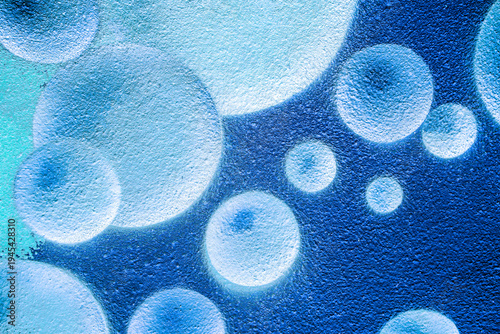 urban street wall aerosol graffiti painting with drawing of colorful round bubbles and balls in space