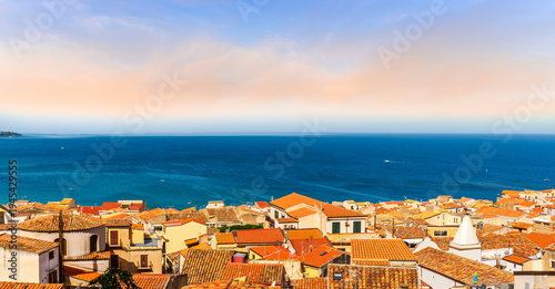 nice holiday sea town landscape of beautiful mediterranean city with old traditional italian houses and tile roofs with blue sea water and awesome sky on background