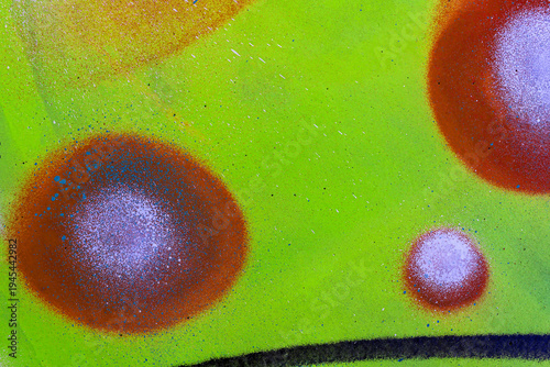 colorful background pattern of urban streen wall graffiti for concept and design. Aerosol bright vivid painting on a city walls