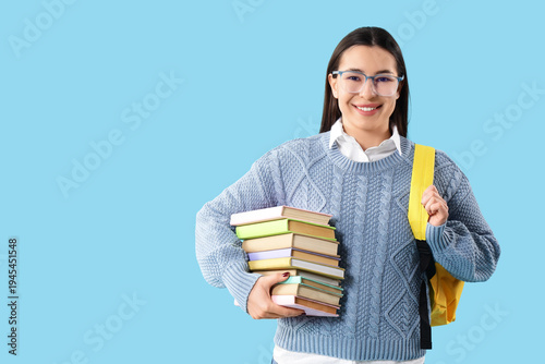 Female student with stack o...