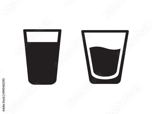 Two glasses with different liquid levels  empty and half full glasses side by side