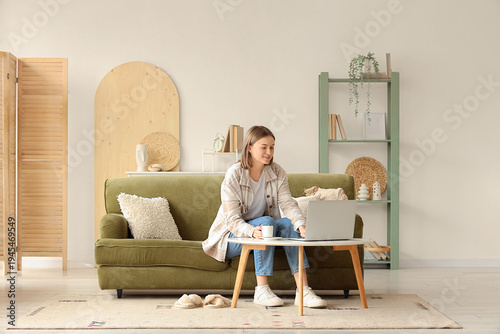 Beautiful young woman using...