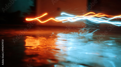 Light trails reflecting on wet surface at night