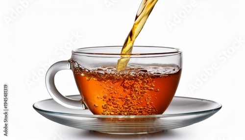 Pouring Tea Into A Cup Isolated On White