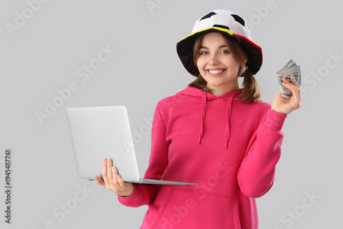 Happy young woman with mone...