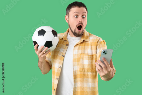 Shocked young man with socc...