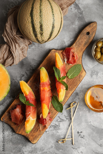 Wooden board of fresh melon...