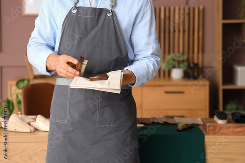 Male shoemaker with shoe po...