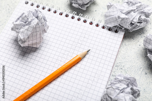 Notebook and crumpled piece...