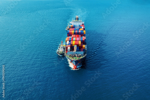 Stock images of Ship carrying containers with crude oil barrels from the harbour. Ship blocked in harbour.