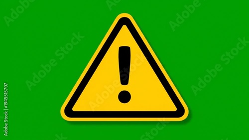 Warning sign flashing with exclamation mark over green screen background for alerts and danger notifications animated motion graphic footage
