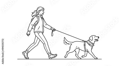 Woman walking dog on leash outside.