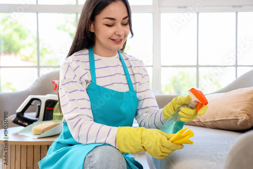 Female janitor cleaning sof...