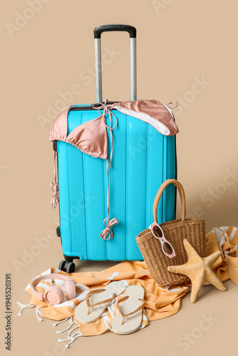 Blue suitcase with stylish ...