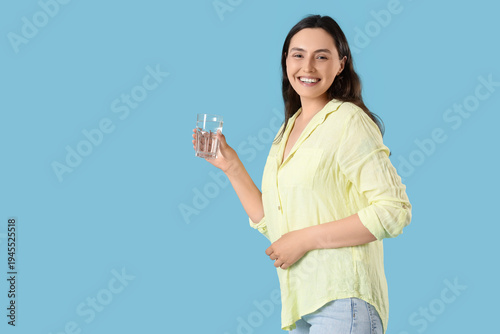 Young woman with glass of w...