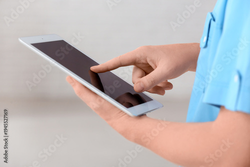 Male doctor with modern tab...