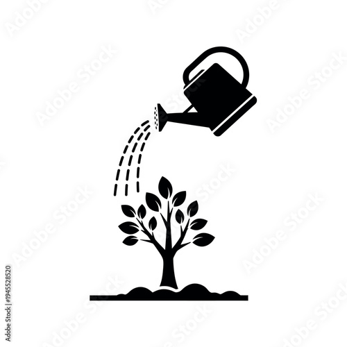 Watering can nurturing a small tree sapling.